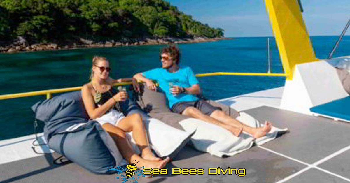 	a young couple relaxing on the sundeck of Seabees Marco Polo after a similian islands liveaboard dive trip						 								 								 								 								 								 								 								 								 								 								 								 																								